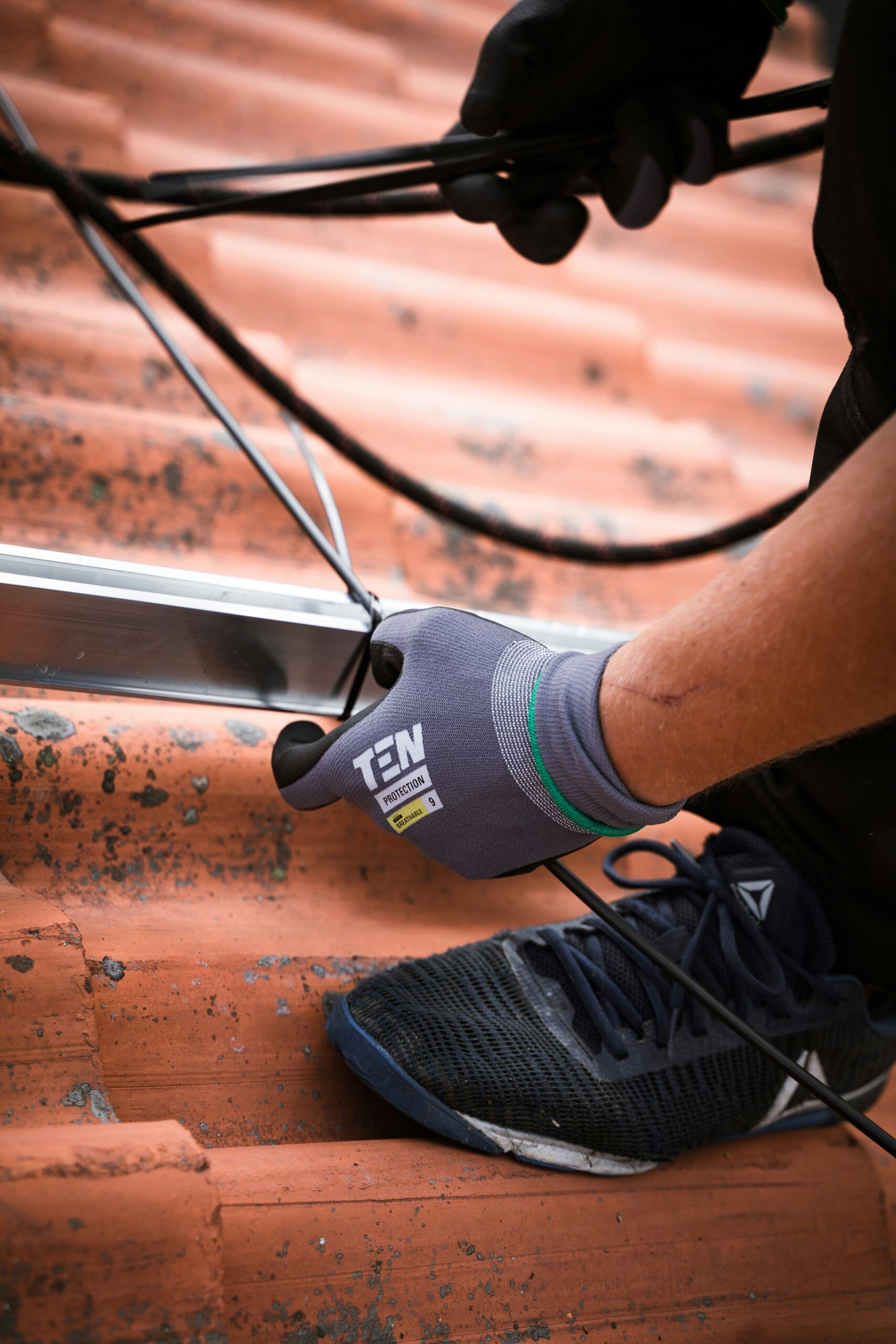 photo of an electrician working on wires